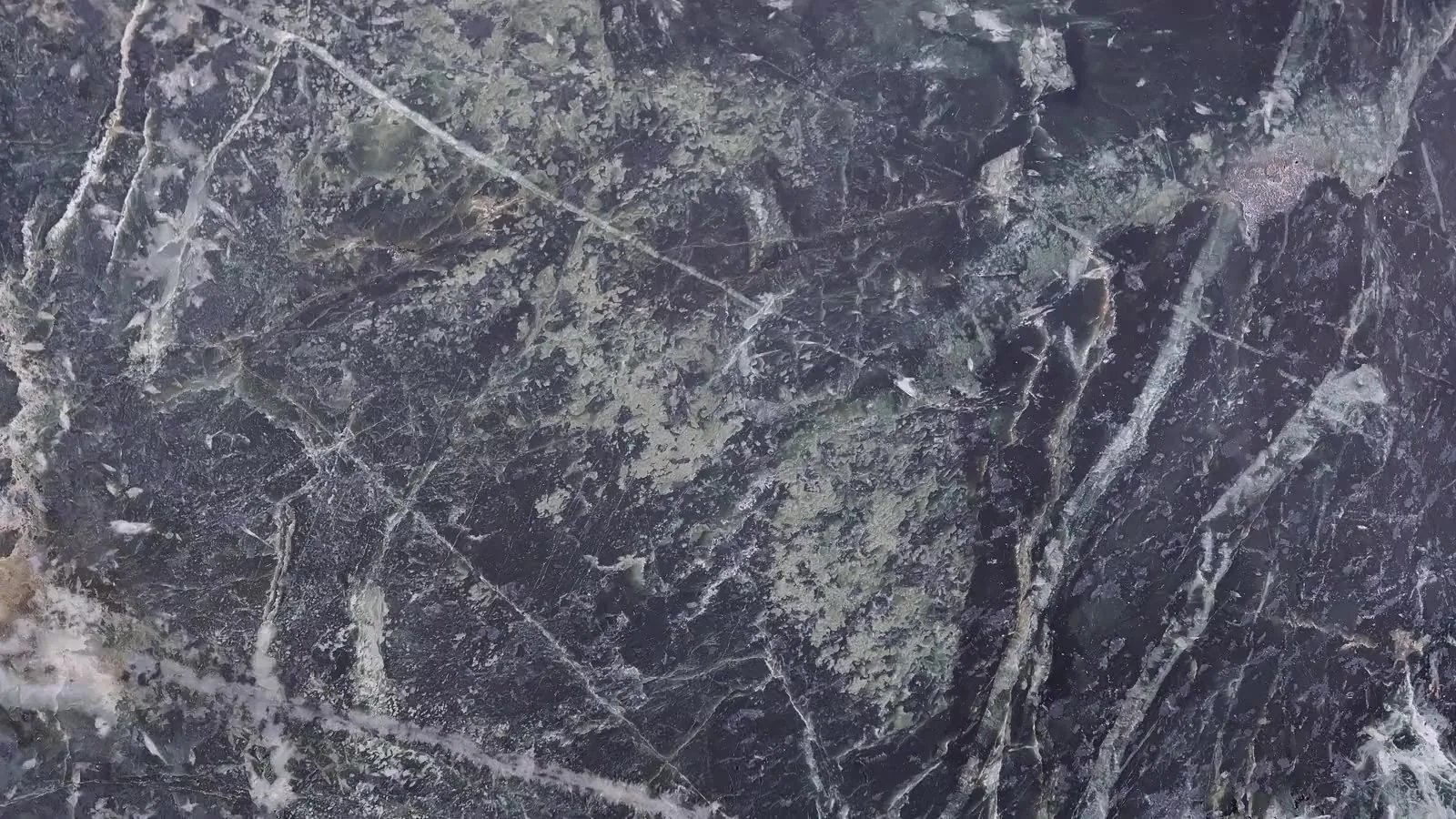 Extreme close-up of dark natural stone texture